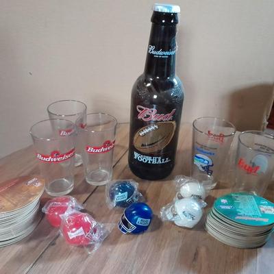 LOT 100 BUDWEISER COLLECTIBLES, BOTTLE, HELMETS, AND GLASSES