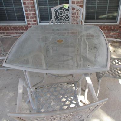 Tan Glasstop Patio Table and Chairs
