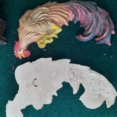 LOT 78 TWO CHALKWARE ROOSTERS, AND AN EAGLE STATUE
