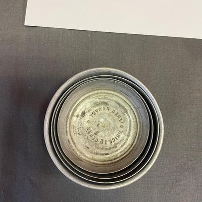 Collapsible cup and pouch of buttons