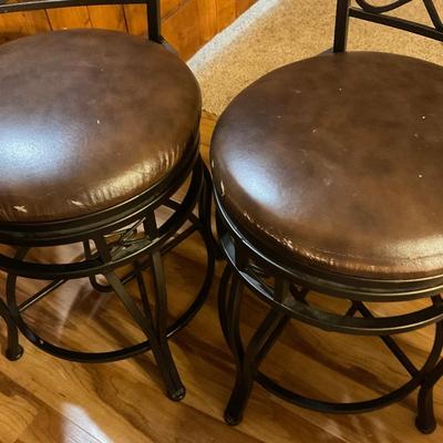 Two counter height swivel stools
