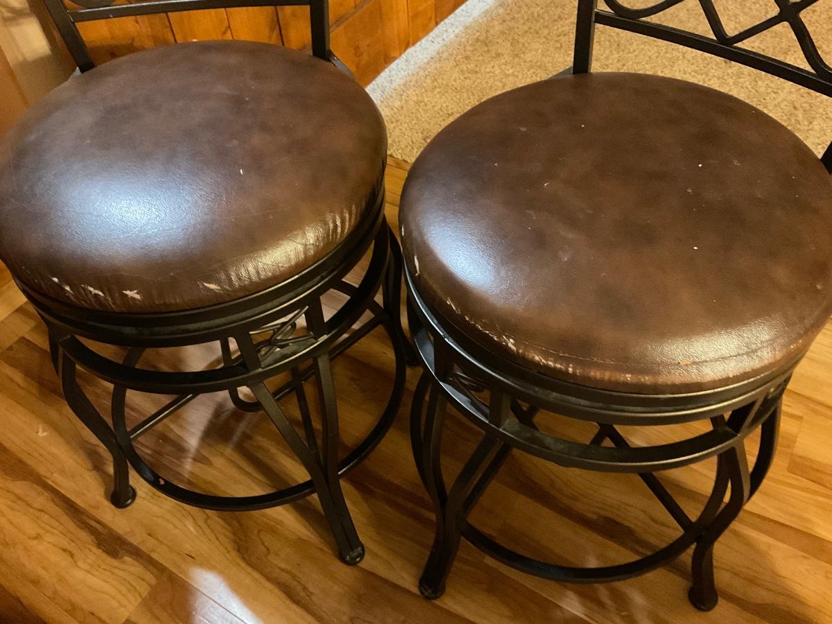 Two counter height swivel stools