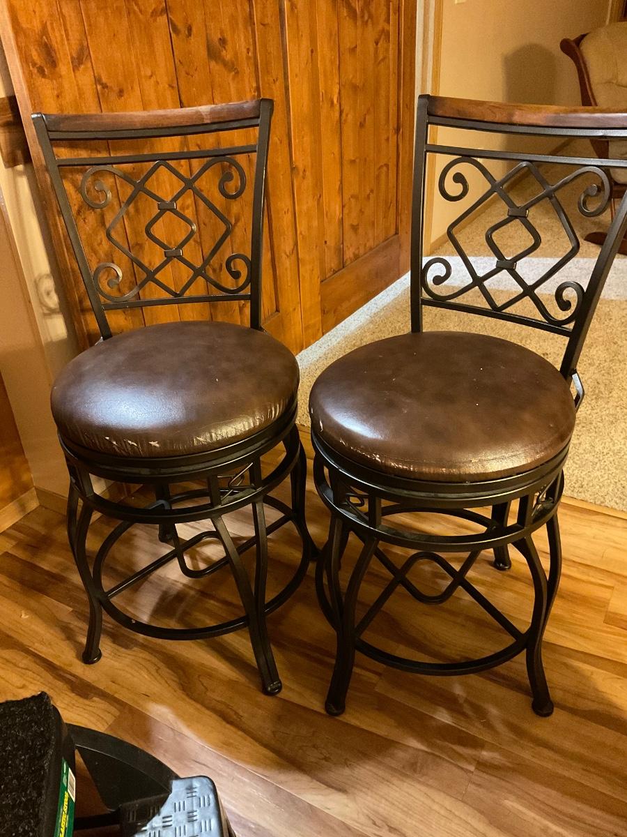 Two counter height swivel stools
