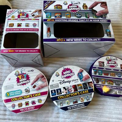 Mini Brands cases and store display boxes