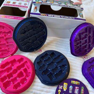 Mini Brands cases and store display boxes