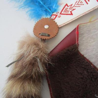 #23 Child's vest, head dress, and pouch