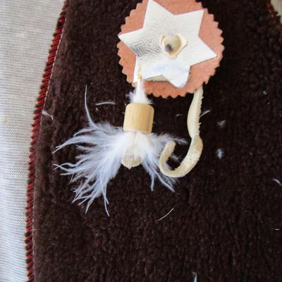 #23 Child's vest, head dress, and pouch