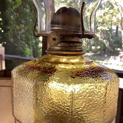 Amber glass oil lamp with equestrian shade
