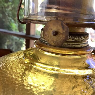 Amber glass oil lamp with equestrian shade