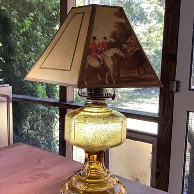 Amber glass oil lamp with equestrian shade