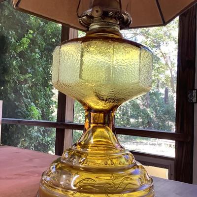 Amber glass oil lamp with equestrian shade