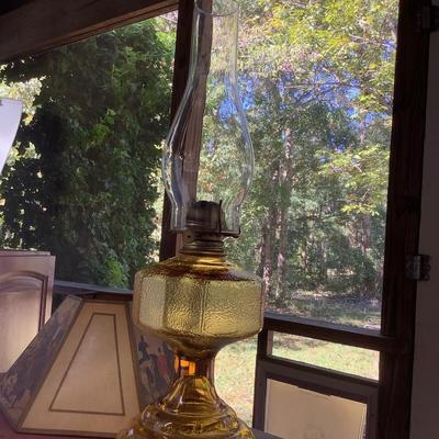 Amber glass oil lamp with equestrian shade