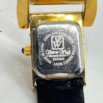 LOT 91: Victoria Weick Beverly Hills Fashion Watch with Velvetized Leather Band (band shedding - needs battery)