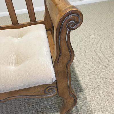 Carved wood bench with upholstered seat