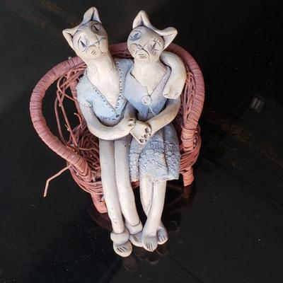 Hand made ceramic cats on loveseat