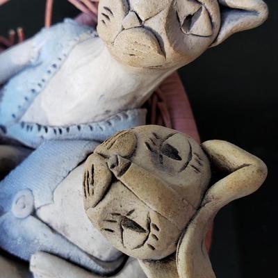 Hand made ceramic cats on loveseat
