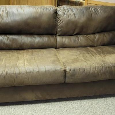 Well loved leather Sofa