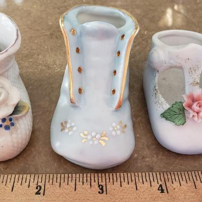 3 porcelain miniature baby shoes