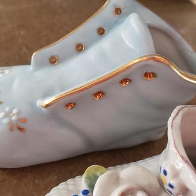 3 porcelain miniature baby shoes