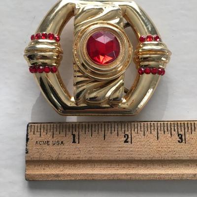 Gold tone faux ruby red center stone