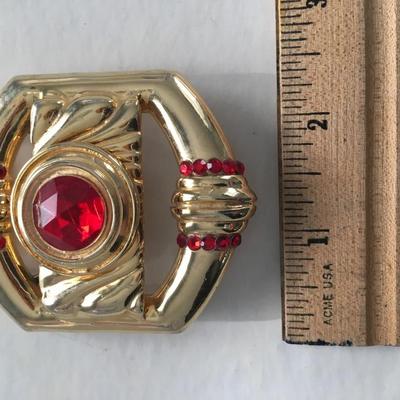 Gold tone faux ruby red center stone