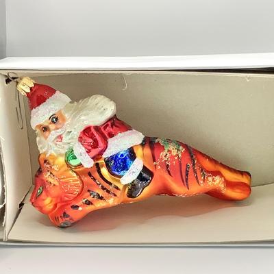 Lot 1336 Christopher Radko Glass Ornament, Santa Riding Tiger, with box