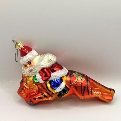 Lot 1336 Christopher Radko Glass Ornament, Santa Riding Tiger, with box