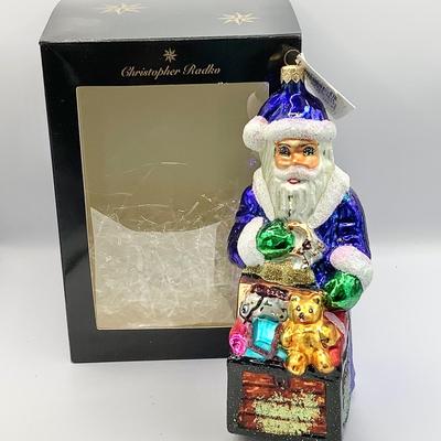 Lot 1342 Christopher Radko Glass Ornament, 1996 Santa in Blue Toy Chest  with box