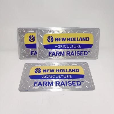 NEW HOLLAND AGRICULTURE FARM RAISED LICENSE PLATES LOT OF 3