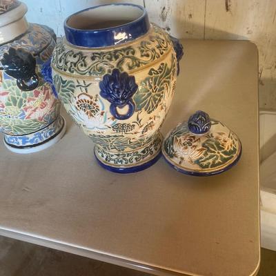 Two oriental pots with removable lids