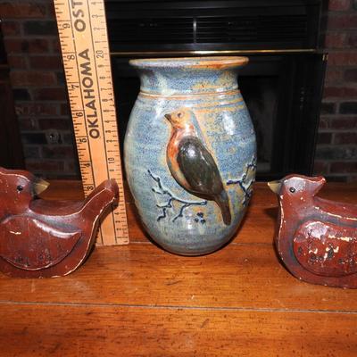 Pottery vase and wood carved Cardinals