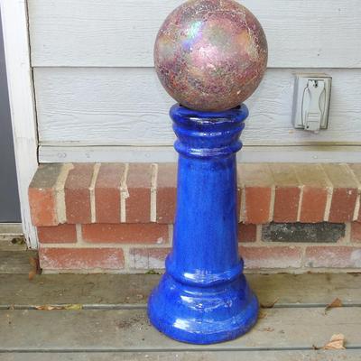Beautiful glass gazing ball with terracotta pedestal