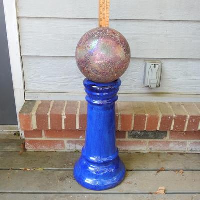 Beautiful glass gazing ball with terracotta pedestal