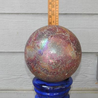 Beautiful glass gazing ball with terracotta pedestal
