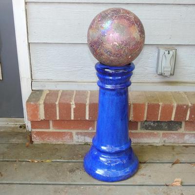 Beautiful glass gazing ball with terracotta pedestal