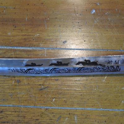 Sword in leather scabbard