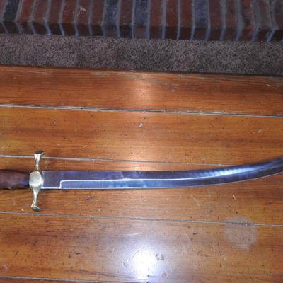 Sword in leather scabbard