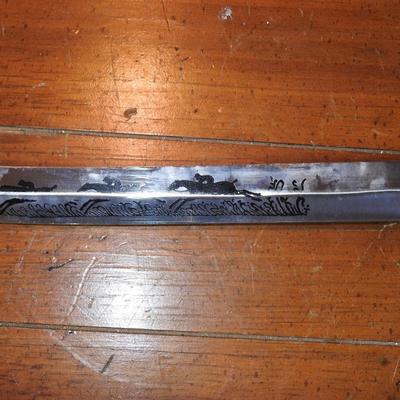 Sword in leather scabbard