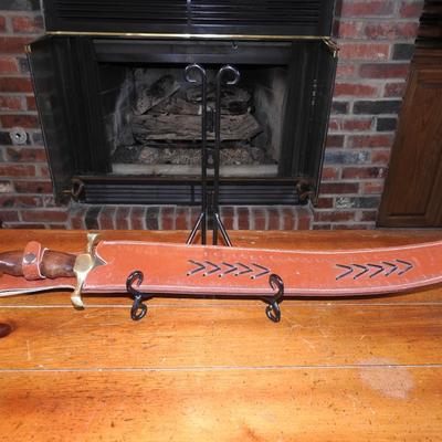 Sword in leather scabbard