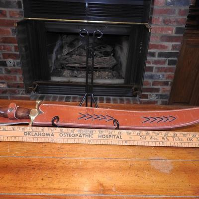 Sword in leather scabbard