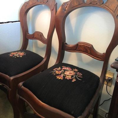 2 carved rosewood needlepoint chairs