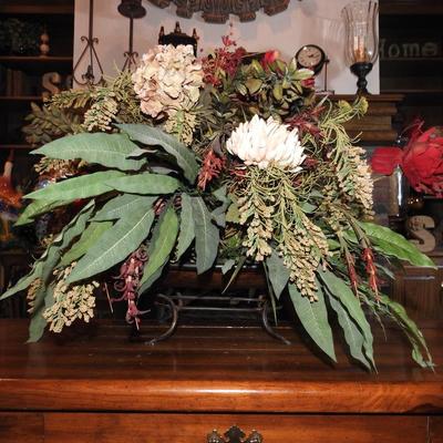 Large floral arrangement in copper pot