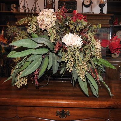 Large floral arrangement in copper pot