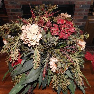 Large floral arrangement in copper pot