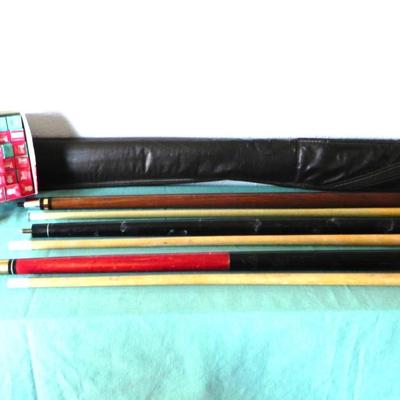 THREE PROFFESIONAL POOL CUES AND BOX OF CHAULK CUE CUBES