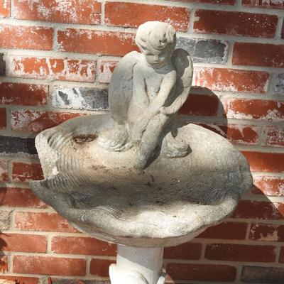 Concrete cherub bird bath