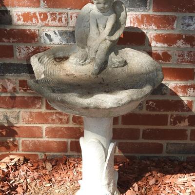 Concrete cherub bird bath