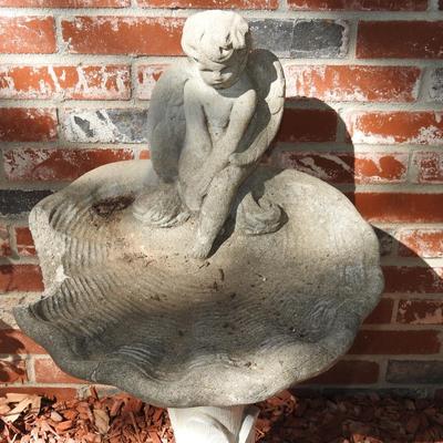 Concrete cherub bird bath