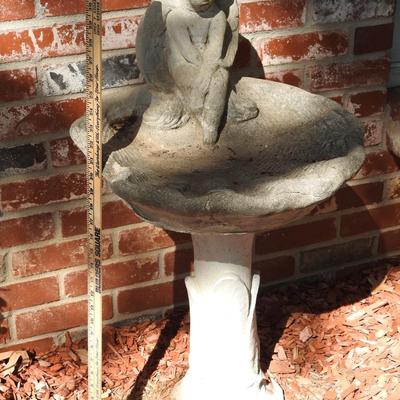 Concrete cherub bird bath