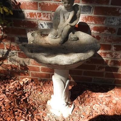 Concrete cherub bird bath